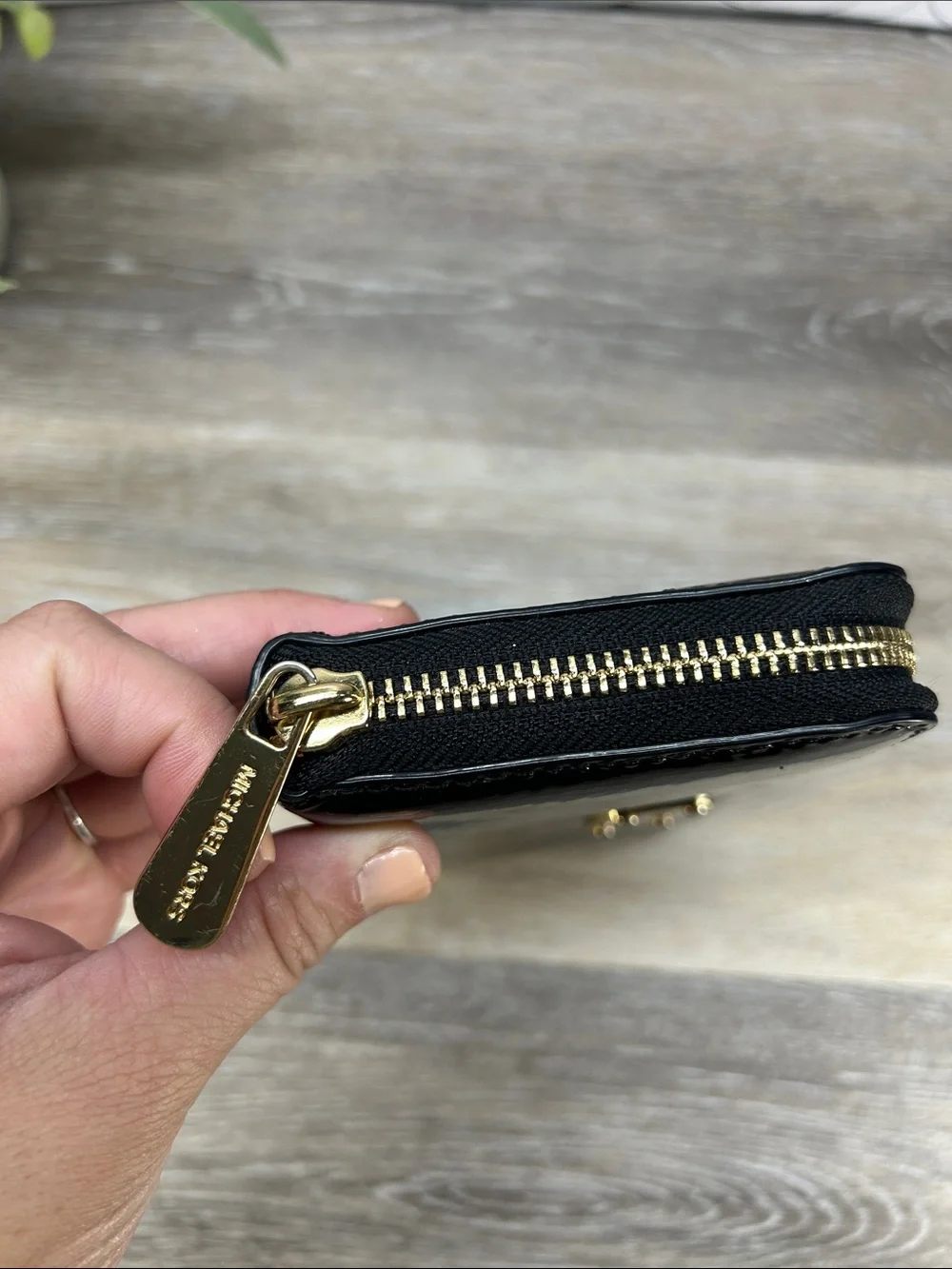 2828 Michael Kors Black Patent Leather Zip Wallet with Gold Plaque
